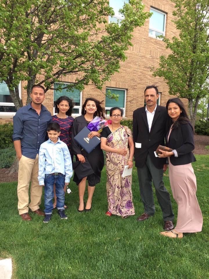 Kharka is pictured on her OCC graduation day in 2016. Pictured (left to right) are brother-in-law Naresh Kharel '17, sister Karuna, Keshari, mother Bhim Karka, father Nila Kharka, and her sister Ganga. In the front is her brother Prabin.