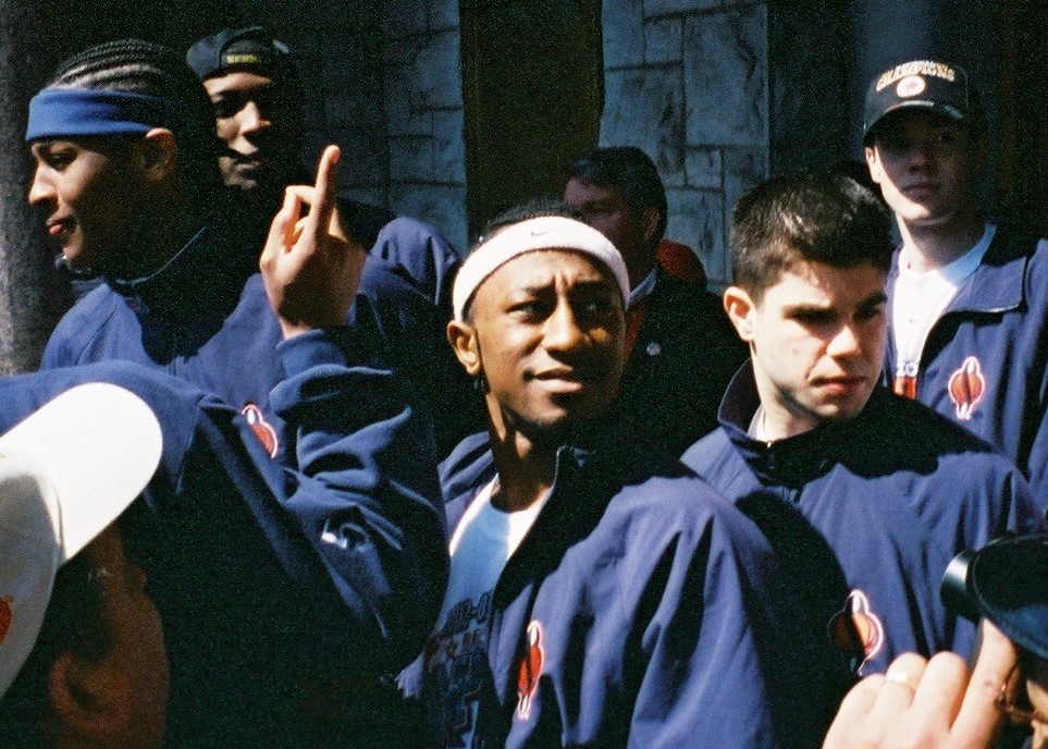 Albright (wearing white head band) stands on the steps of Syracuse City Hall during a celebration of SU's National Championship.