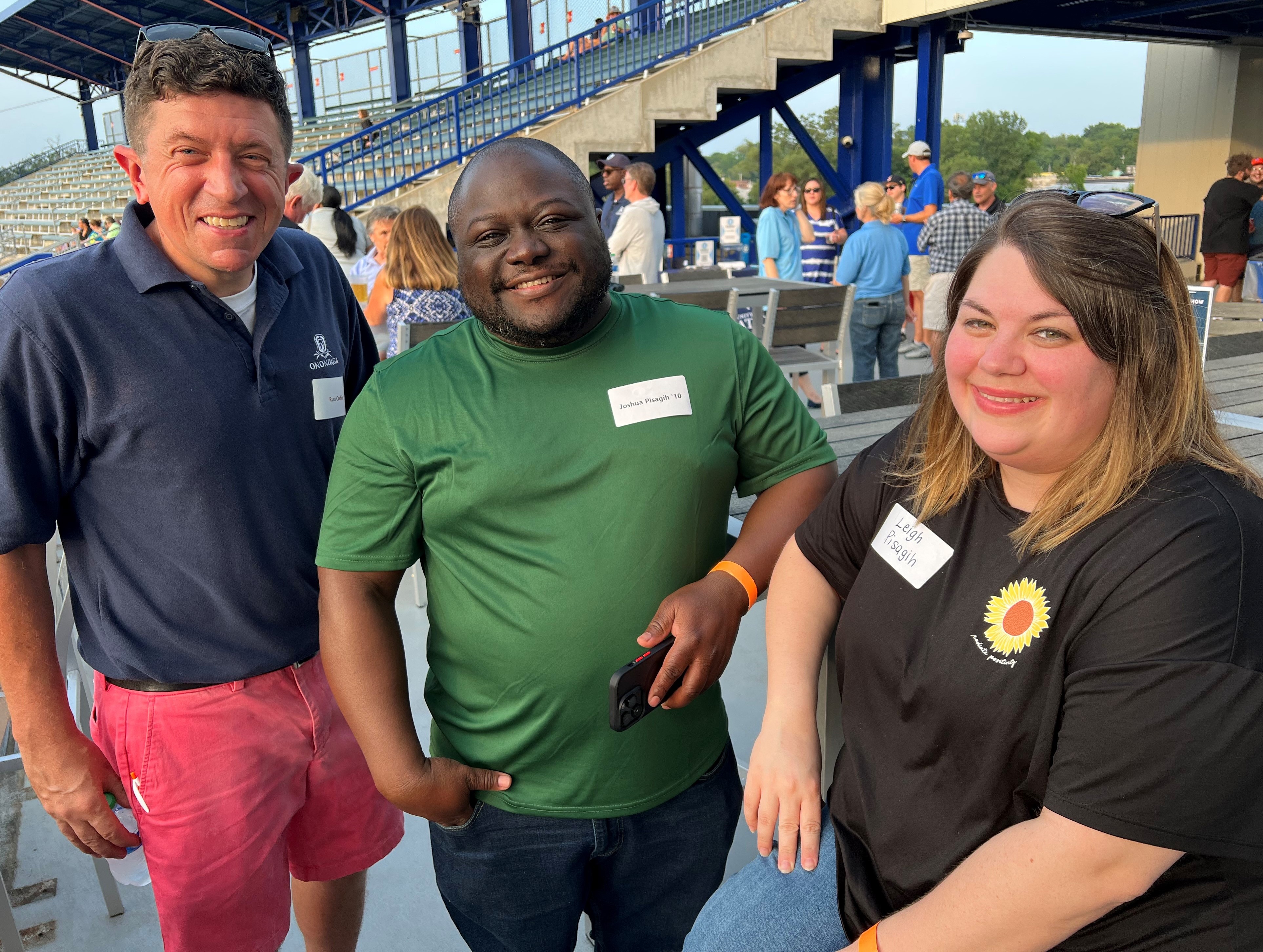 Russ Corbin, OCC's Director of Alumni Relations & Community Connections (left) with Joshua Pisagih '10 (center) and Leigh Pisagih (right). It was the Pisagih's first night out since becoming parents 3 months ago.