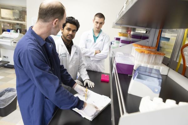 OCC student Mohammed Noor (center) did research this summer at SUNY Binghamton.