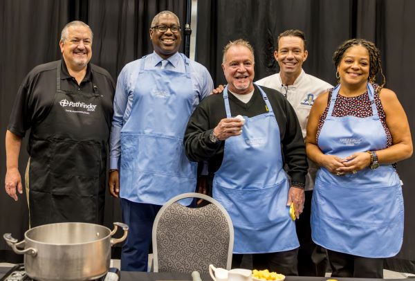 Participating in the Celebrity Cook off were (left to right) James A. Dowd of Pathfinder Bank, OCC President Dr. Warren Hilton, Mark Re '85 of Howard Hanna Real Estate, OCC Hospitality Management Chef James Taylor who emceed the event, and New York State Assembly member Pamela Hunter.