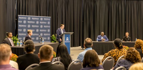 Participants in the panel discussion included (left to right) Dr. Reginald Hicks, Chips for America; Gordon Jones, College of Western Idaho President; NewsChannel 9's Andrew Donovan; Onondaga Community College President Dr. Warren Hilton, and Onondaga Community College Professor Mike Grieb.